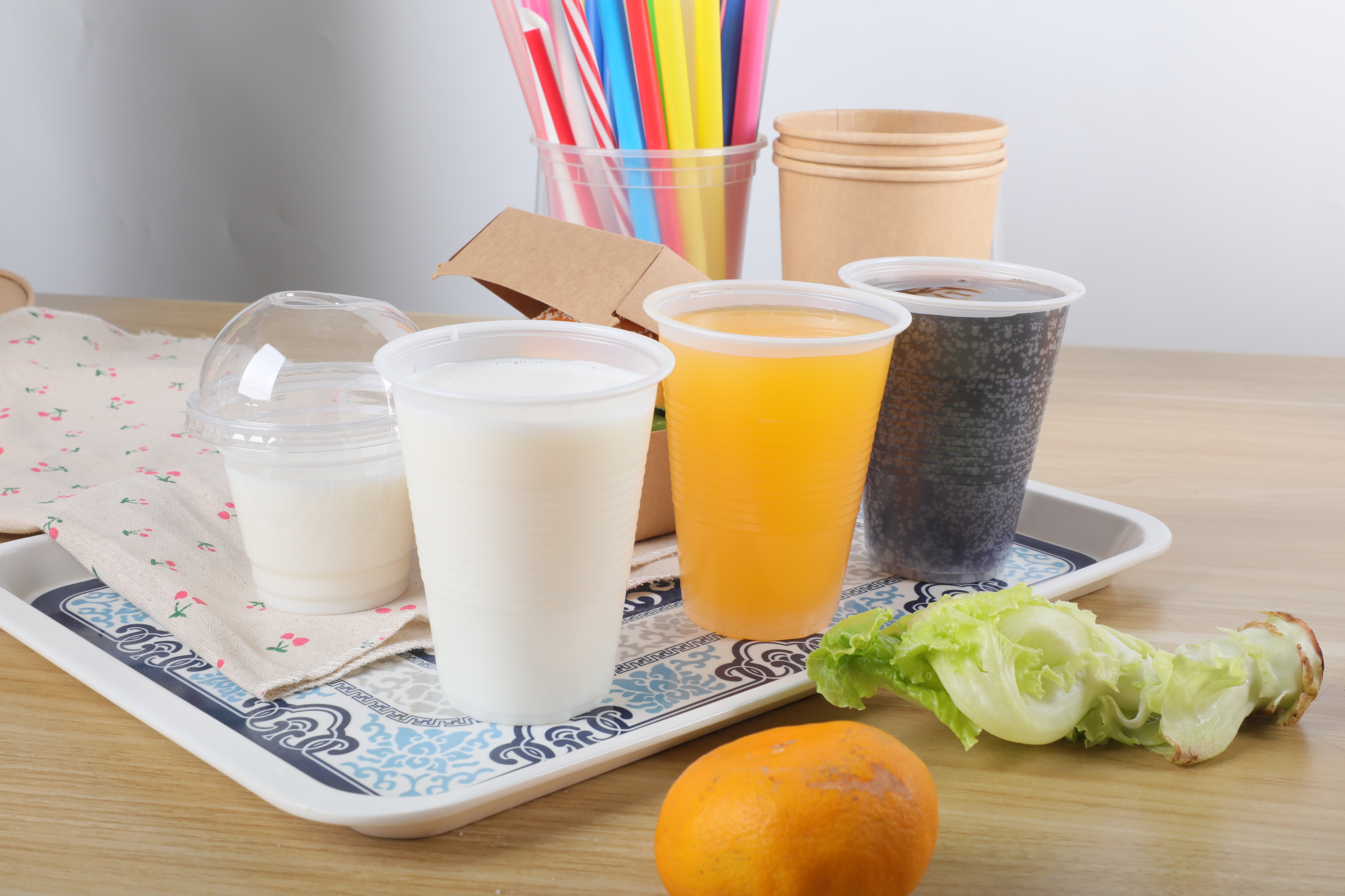 What are the degradation time and environmental impact of plastic spoon straws